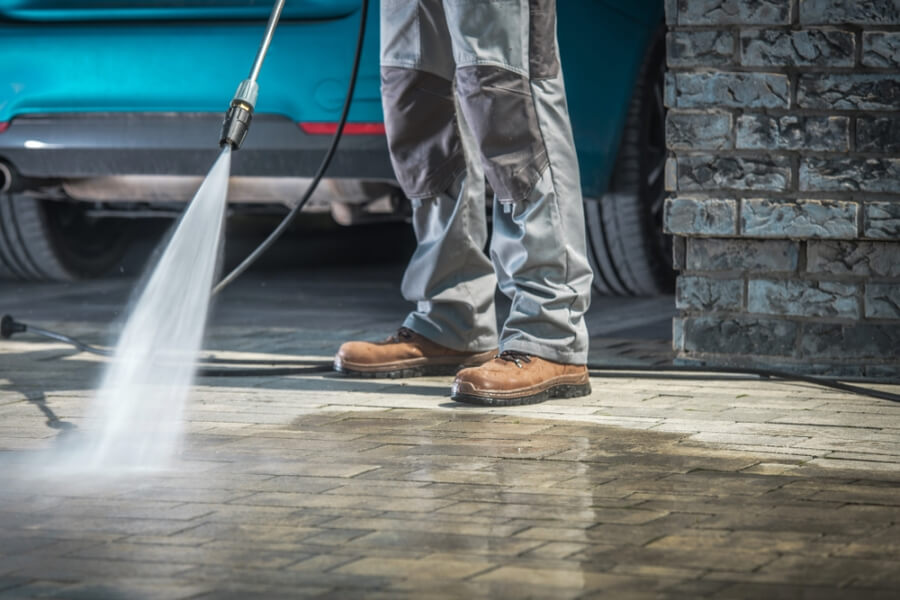 Pressure washing interlock driveway